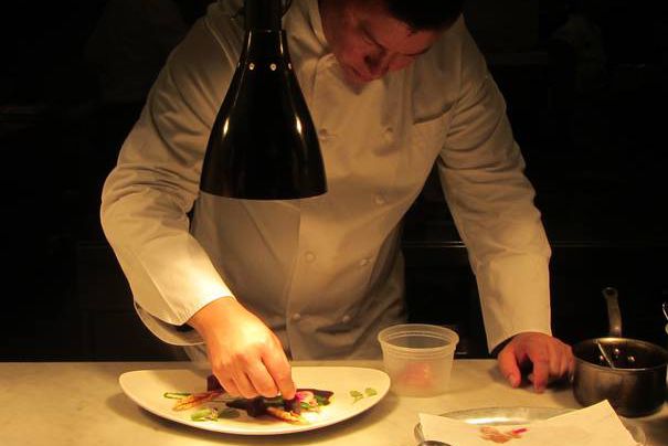 Chef Hergatt puts the finishing touches on his Acacia Glazed Duck